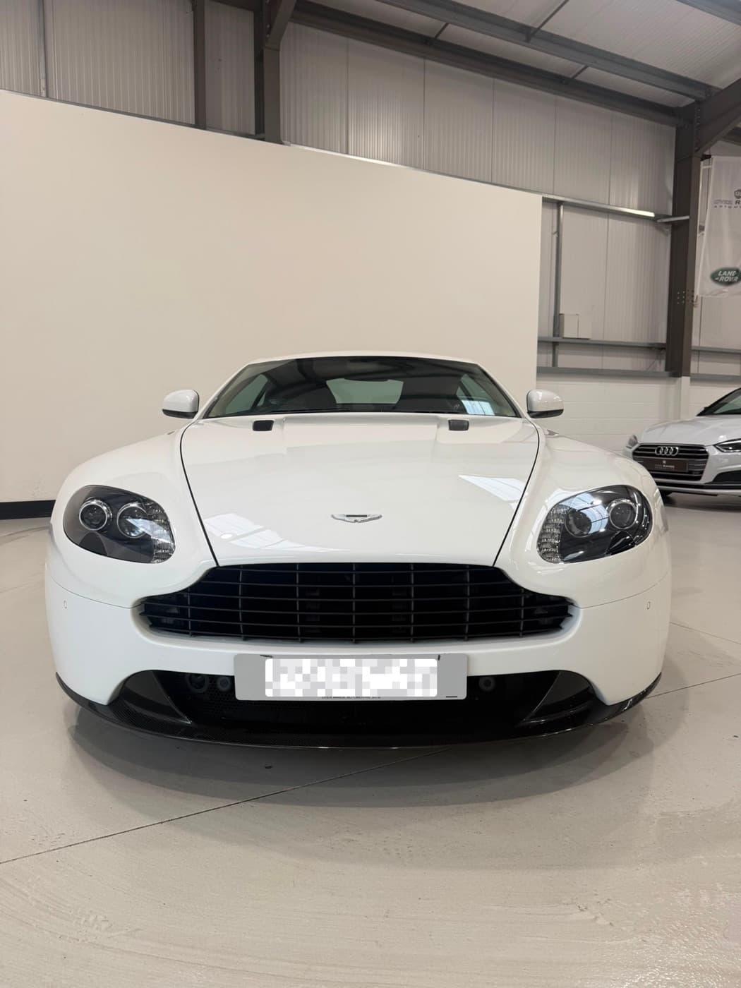 White Aston Martin Vantage after a full detail
