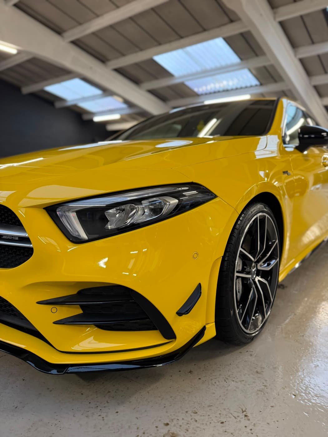 Yellow Mercedes-AMG A-Class with a deep gloss finish
